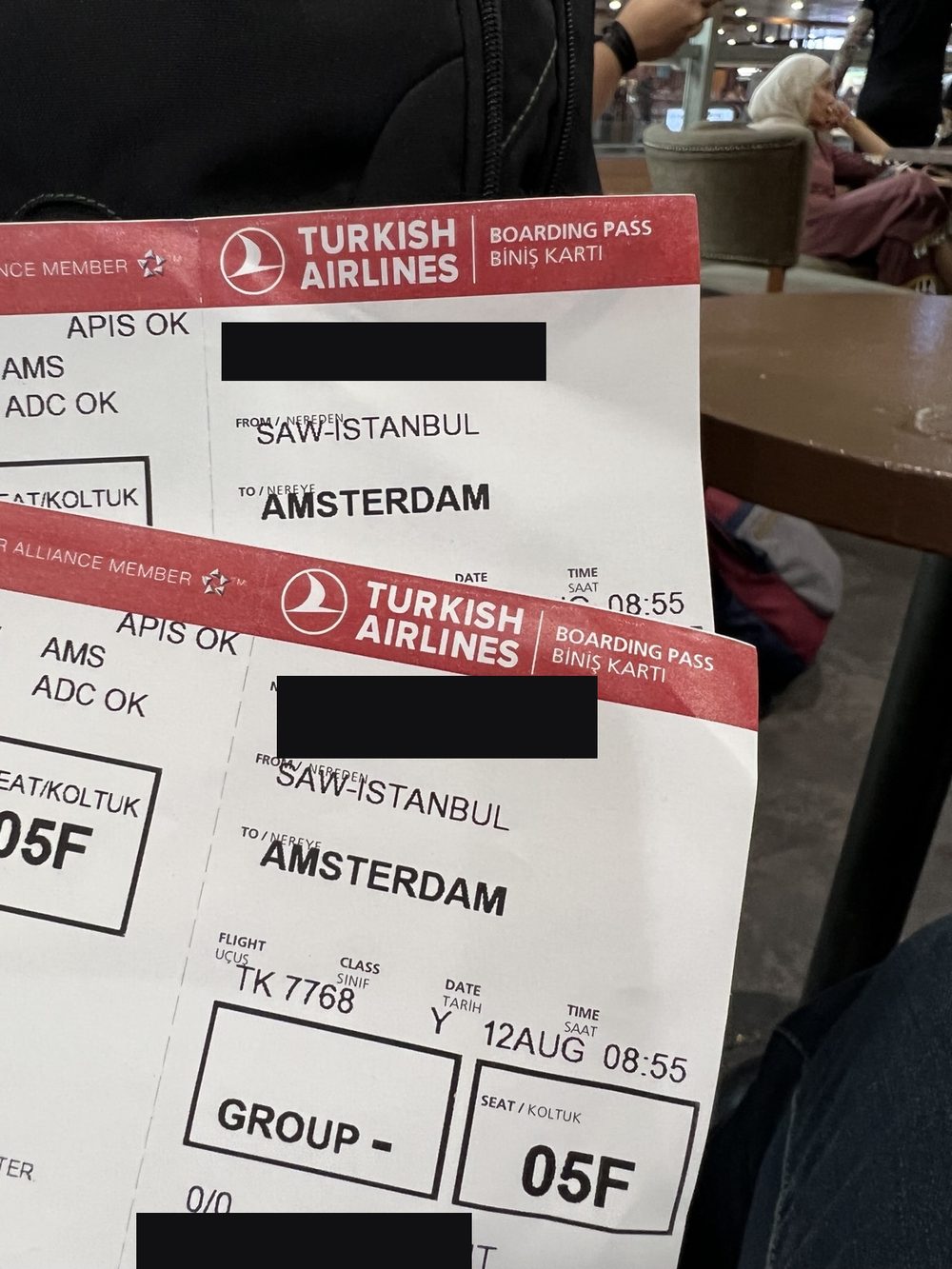 Our boarding passes from Istanbul to Amsterdam on 12 August, with personal details redacted.